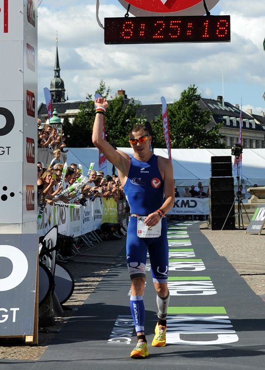 COPENHAGEN, DENMARK - AUGUST 12: Jimmy Johnsen crosses the finish line to place third during the iron distance triathlon KMD Challenge Copenhagen 2012 on August 12, 2012 in Copenhagen, Denmark. (Photo by Chris Brunskill/Getty Images) *** Local Caption *** Jimmy Johnsen