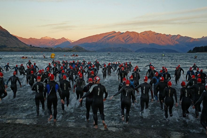 WANAKA, NEW ZEALAND - JANUARY 21: Athletes entre the water for the Challenge Wanaka on January 21, 2012 in Wanaka, New Zealand. (Photo by Phil Walter/Getty Images)