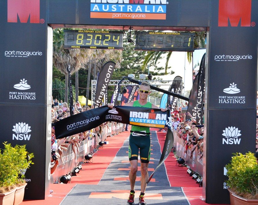 Luke Bell celebrates his maiden Ironman win in Port Macquarie earlier this year