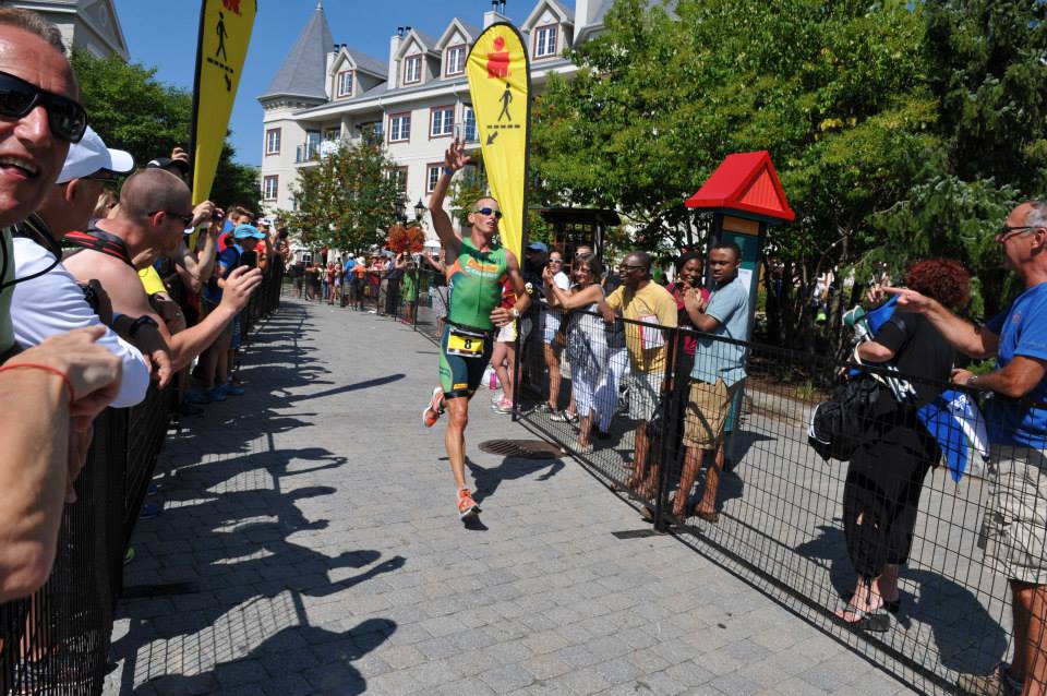 Bell runs through the cobblestone streets of the Mont Tremblant towards the finish line