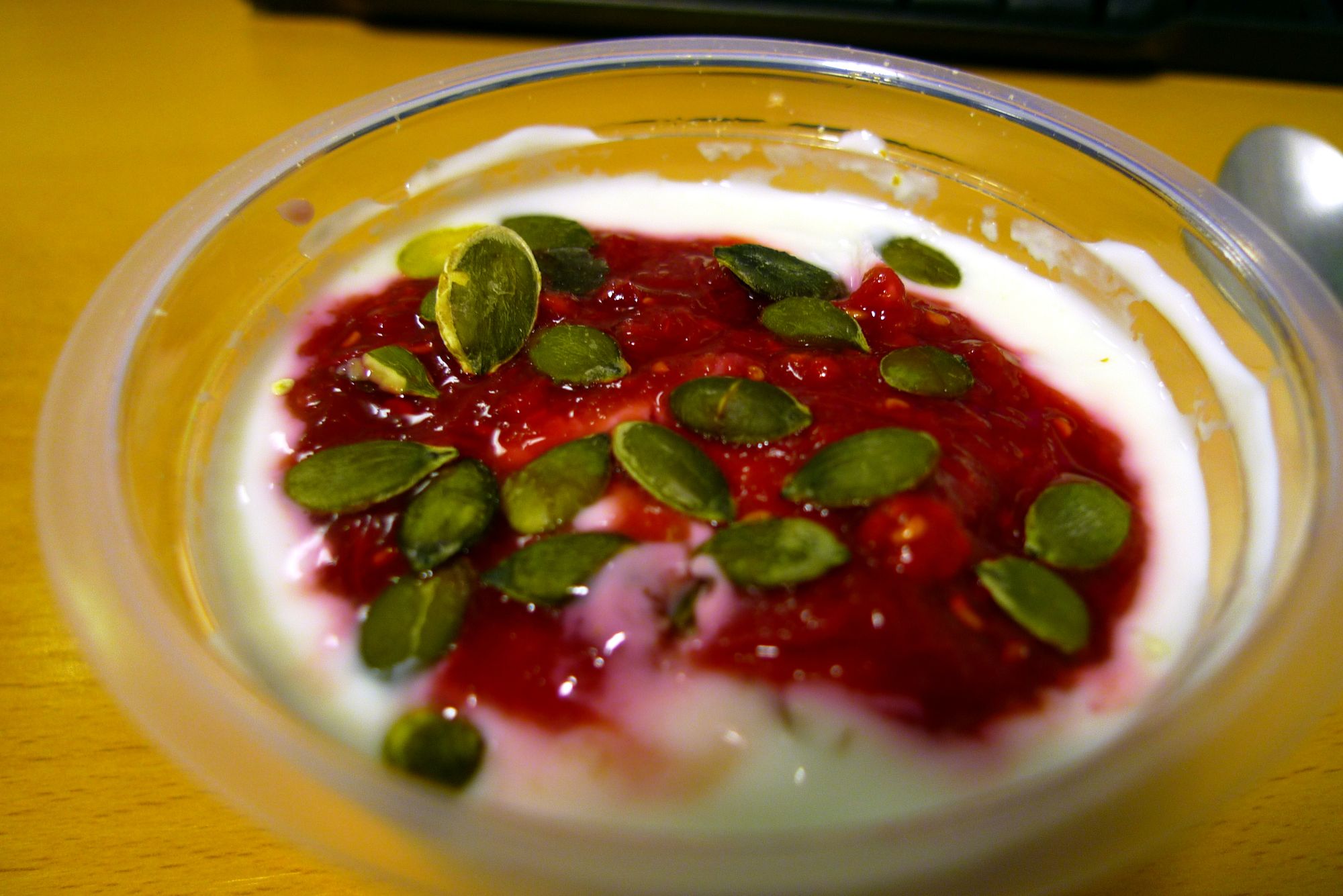 Yoghurt with raspberry compote and muesli