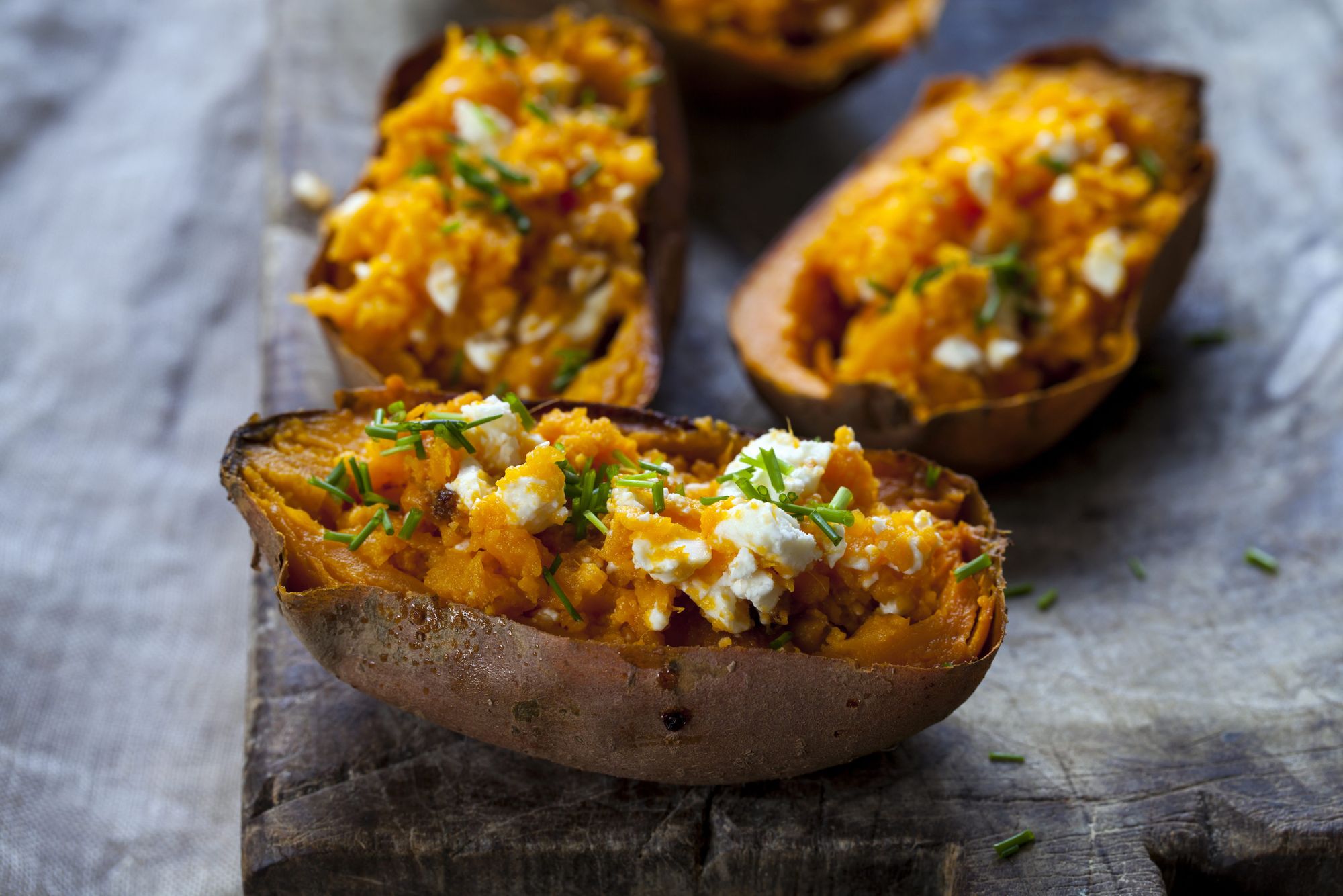 Baked sweet potato with feta cheese and chives